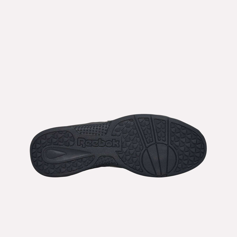 The Reebok Hammer Pro LTD Shoes feature a durable rubber sole with textured grip patterns, circular tread, and the Reebok logo embossed at the center. Crafted from faux leather, these black sneakers are displayed against a plain white background.