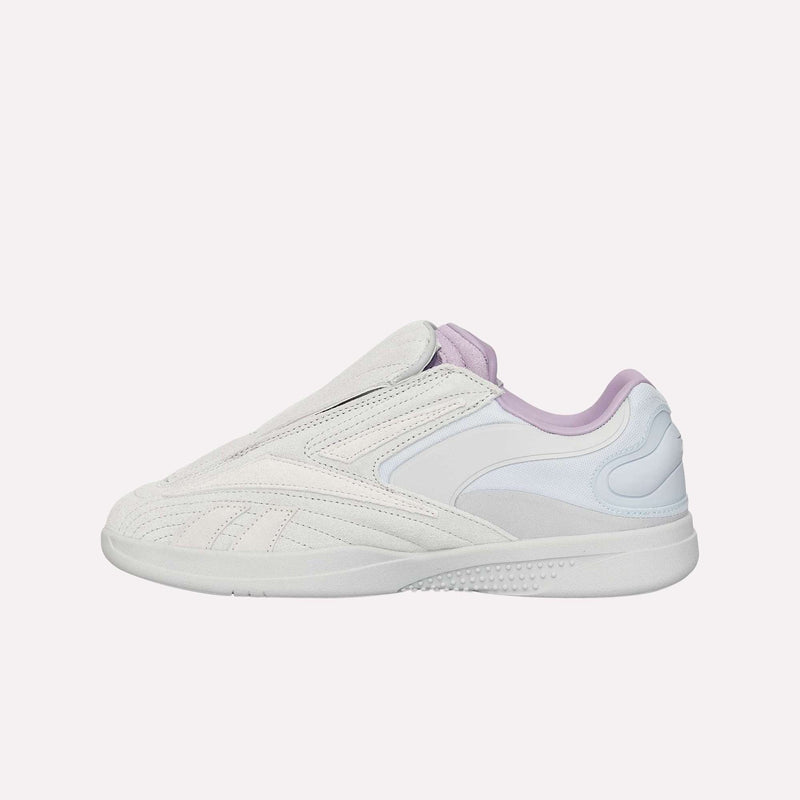 A pair of Reebok Hammer Pro LTD Shoes in white and light purple, featuring a curved silhouette, minimalistic lacing, a sturdy rubber sole, and a premium suede upper, displayed against a simple light background.