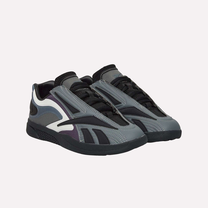 A pair of Reebok Hammer Pro LTD Shoes, designed with gray, black, white, and purple panels, a durable rubber sole, and a faux leather upper, featuring black laces and a modern sporty look, are displayed side by side on a plain background.