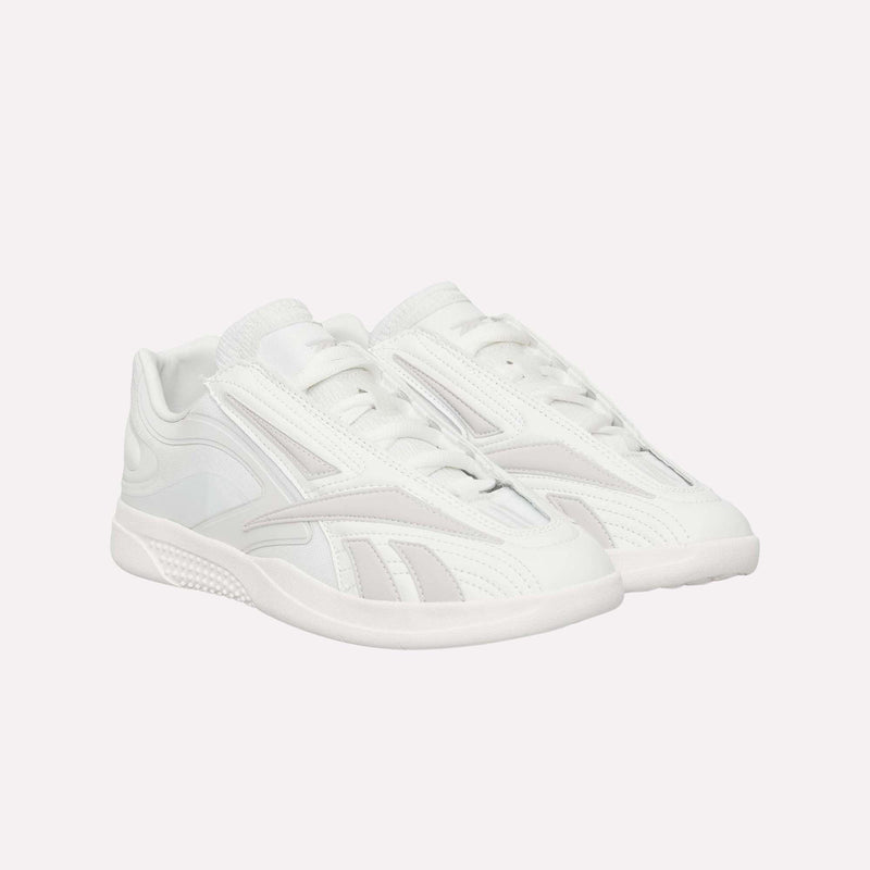 A pair of Reebok Hammer Pro LTD Shoes in white faux leather, highlighted with subtle light gray accents and a durable rubber sole, showcases a sleek, modern design against a plain white background.