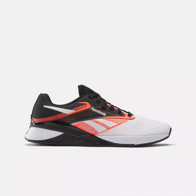 Black and white running shoe with orange accents on a light gray background