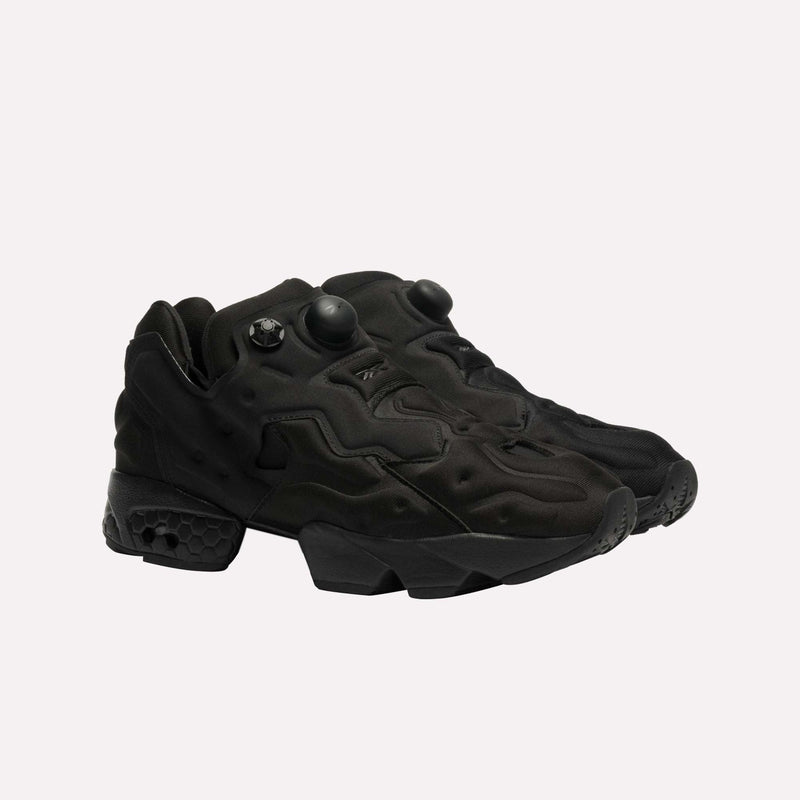 A pair of Reebok Instapump Sliver LTD Shoes in black, boasting a futuristic chunky design with textured details and innovative Hexalite cushioning for superior comfort, displayed on a plain white background.