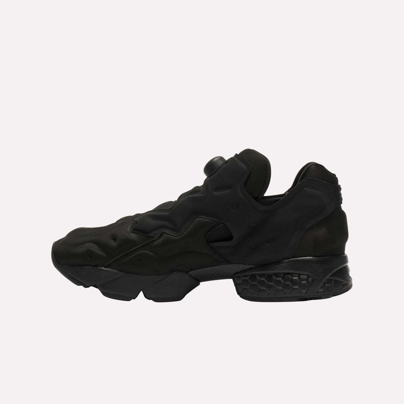 The Reebok Instapump Sliver LTD Shoes are showcased in a side profile view against a plain white background, featuring a unique panel design, black athletic silhouette with a textured sole, and a chunky midsole equipped with Hexalite cushioning.