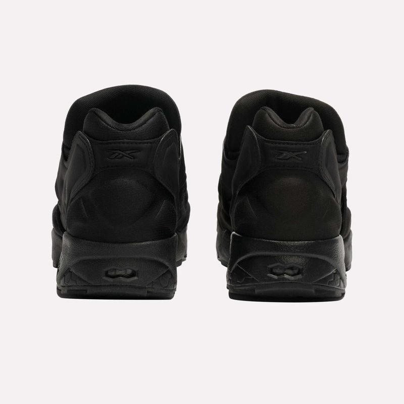 A pair of black Reebok Instapump Sliver LTD Shoes featuring Hexalite cushioning, viewed from the back to display the heels and Reebok logos, set against a plain white background.