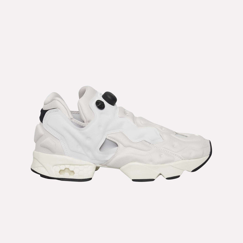 The Reebok Instapump Sliver LTD Shoes in white and light gray feature a chunky sole, textured accents, distinctive cutouts, and Reebok’s signature air pump system for a personalized fit, showcased against a plain white background.