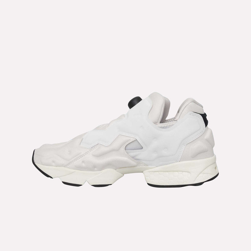 The Reebok Instapump Sliver LTD Shoes are displayed from the side on a plain light background, showcasing their white and light gray colorway, bold chunky sole, futuristic design elements, and signature Hexalite cushioning for superior comfort.