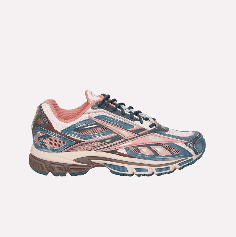 Introducing the Reebok Premier Road Ultra LTD Shoes—a stylish sneaker featuring blue, pink, white, and beige accents inspired by the archival Reebok Premier Road Ultra running sneaker. Designed with mesh and synthetic panels, as well as a cushioned collar, this shoe also boasts a dual-density midsole for exceptional comfort and a textured sole engineered for both comfort and athletic performance.