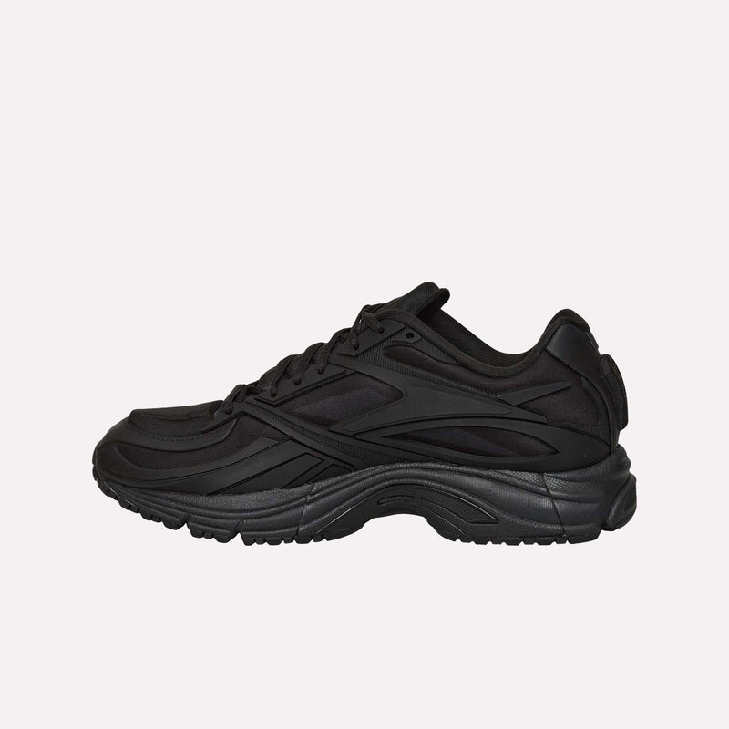 The Reebok Premier Road Modern LTD Shoes are black athletic sneakers with a thick sole, side detailing, and a lace-up closure, inspired by archival running shoe aesthetics and displayed in a side profile view against a plain white background.