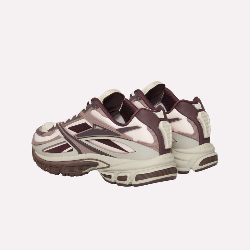 A pair of Reebok Premier Road Modern LTD Shoes in maroon and cream with white accents are displayed side by side on a plain white background, showcasing the back and side views.