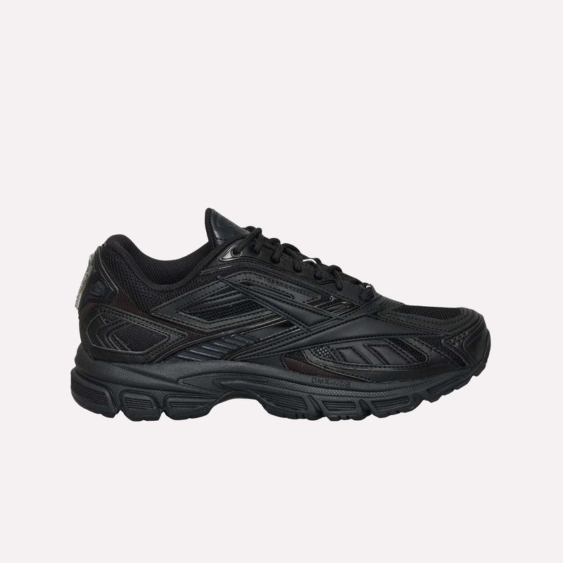 The Reebok Premier Road Ultra LTD Shoes are black athletic sneakers featuring a mesh upper, synthetic overlays, matching black laces, and a thick rubber sole. Shown in a side profile against a plain white background, this design draws inspiration from archival running silhouettes while incorporating modern comfort features.