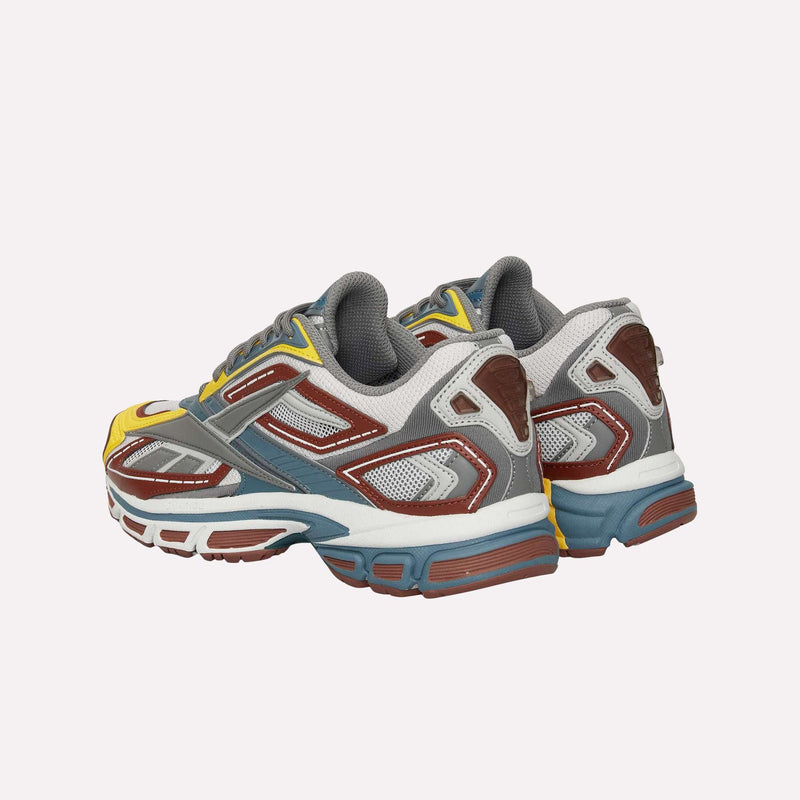 A pair of Reebok Premier Road Ultra LTD Shoes, showcasing a mix of gray, yellow, brown, blue, and white accents with mesh and synthetic panels and a dual-density midsole for enhanced comfort, viewed from the back and side.