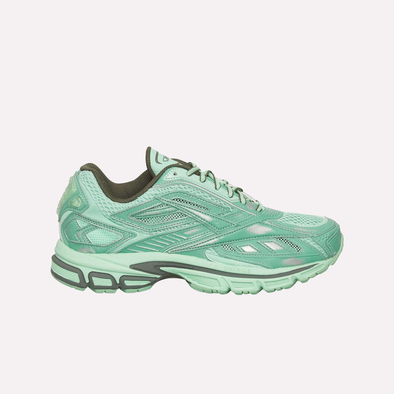 A pair of Reebok Premier Road Ultra Shoes in mint green, featuring intricate paneling, a breathable mesh upper, dark green accents, and a thick, patterned dual-density midsole, is shown against a plain white background—an homage to their archival running sneaker heritage.