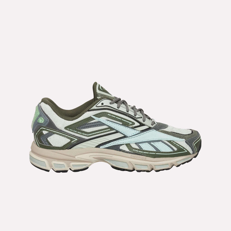 A side view of the Reebok Premier Road Ultra Shoes, a sporty sneaker inspired by archival running shoe aesthetics, featuring green, beige, and light blue accents, mesh panels, and a thick tan and black dual-density midsole.