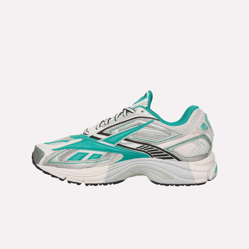 The Reebok Premier Road Ultra Shoes are archival running sneakers in teal, white, and gray with black accents. They feature a dual-density midsole for enhanced comfort and are displayed in a side profile view against a white background.