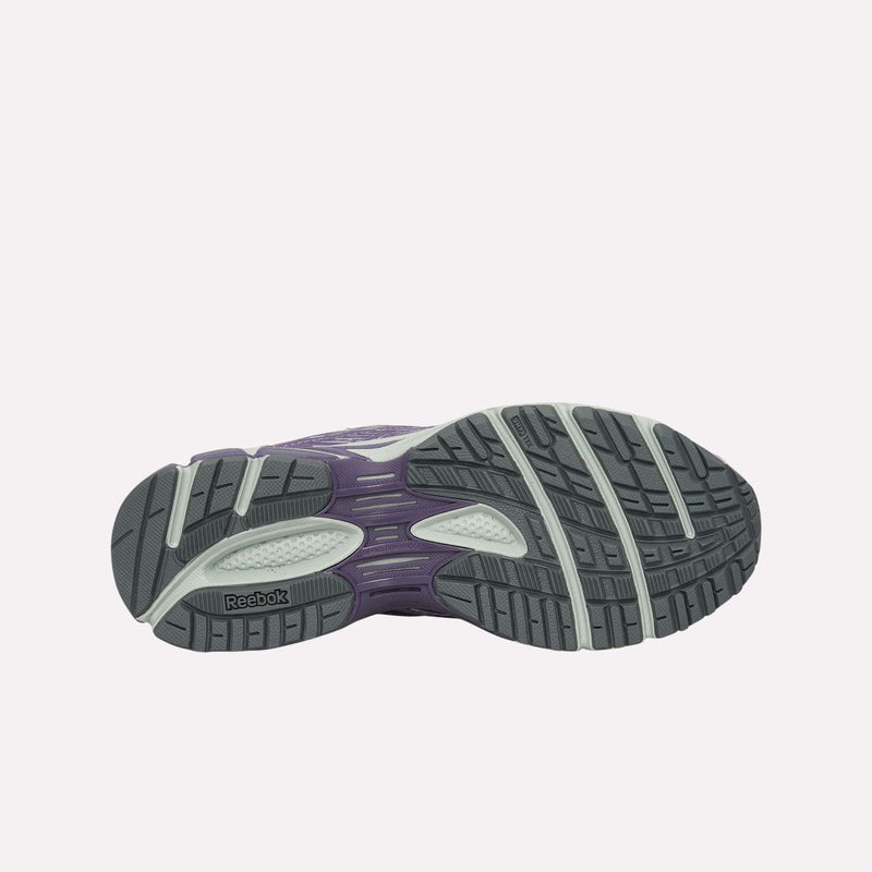 The image displays the bottom view of the Reebok Premier Road Ultra Shoes, highlighting a gray outsole with black and white traction patterns along with a purple dual-density midsole.
