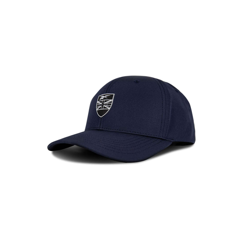 The Reebok 1895 Pro is a navy blue baseball cap with a black and white shield emblem displaying a Union Jack design on the front, shown against a white background.