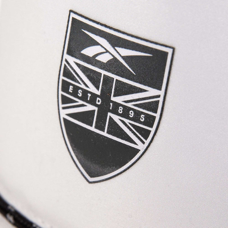 A black and white shield logo with a stylized Union Jack, the Reebok logo, and "ESTD 1895" is displayed on a white background for the Madison product by Reebok.