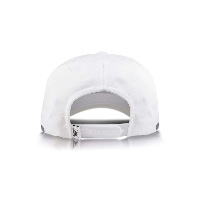 The Reebok Madison snapback hat is shown from the back with an adjustable plastic strap and a small fabric tag on the left side, all set against a white background.