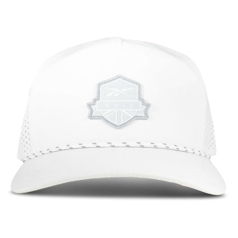 The Reebok Madison Ii is a white baseball cap with a light grey mesh back, adjustable snapback, and a light grey embroidered shield patch on the front. The cap is shown facing forward against a plain backdrop.