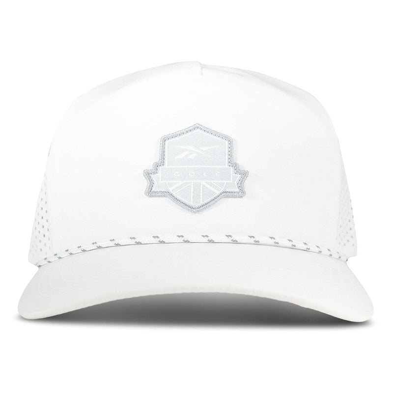 The Reebok Madison Ii is a white baseball cap with a light grey mesh back, adjustable snapback, and a light grey embroidered shield patch on the front. The cap is shown facing forward against a plain backdrop.