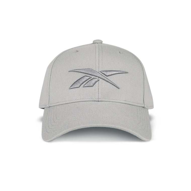 The Reebok Vector Baseball Cap is light gray with a curved brim and matching embroidered logo. It features an adjustable snapback closure and is shown against a white background.
