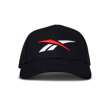 The Reebok Vector Baseball Cap in black features an embroidered red and white Reebok logo on the front, displayed against a white background.