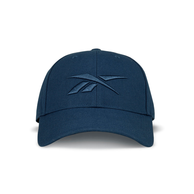 The Reebok Vector Baseball Cap is a blue hat featuring the iconic logo and an adjustable snapback closure for a perfect fit.