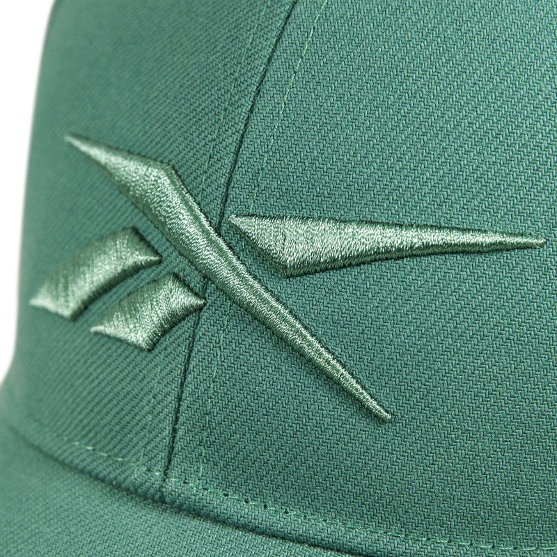 Close-up of a green Reebok Vector Baseball Cap with an embroidered green logo on the front and an adjustable snapback closure for a perfect fit.