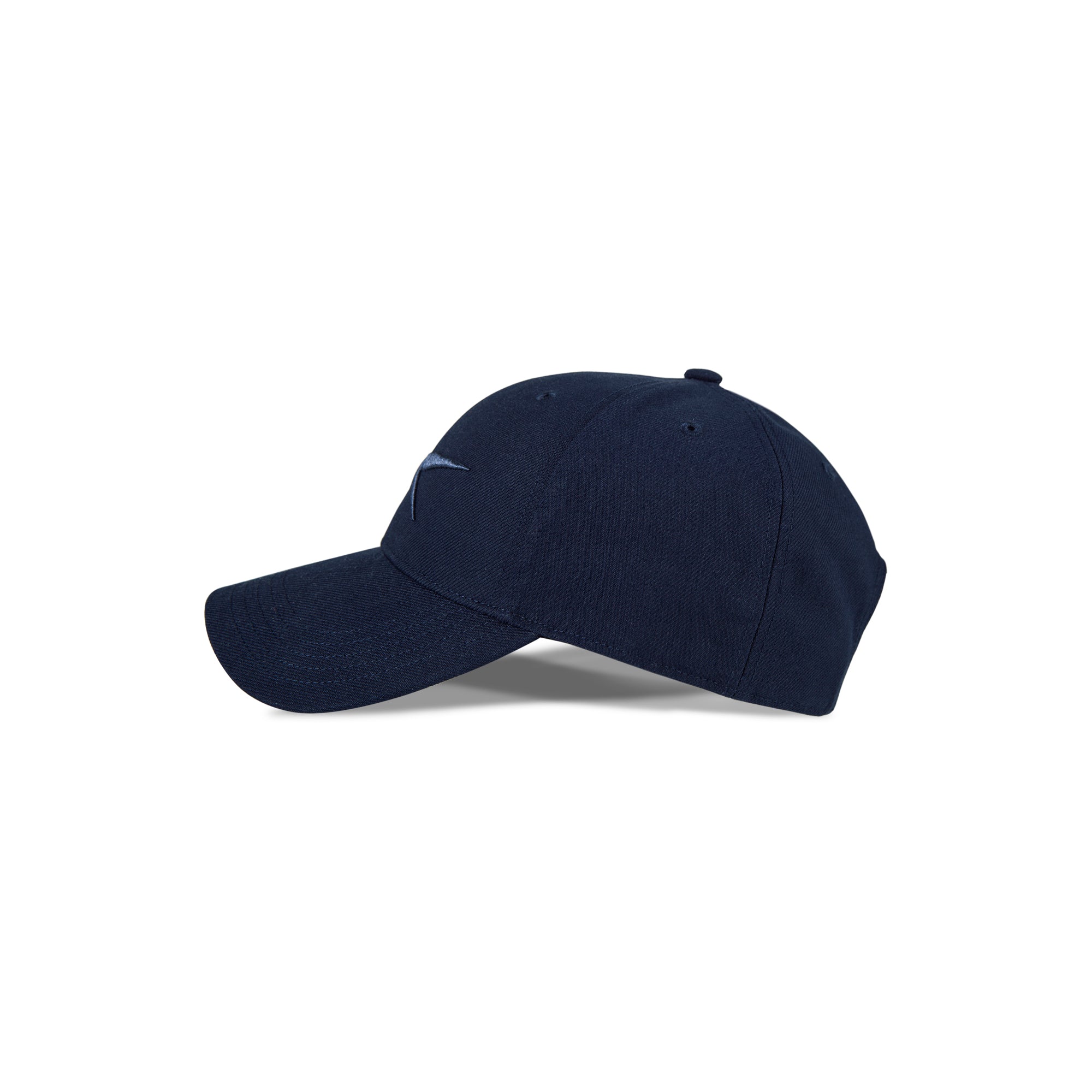 The Reebok Vector Baseball Cap in navy, with a curved brim and adjustable snapback, is shown in side profile on a white background. It features minimal detailing and a small, light-colored front logo for sustainable performance style.