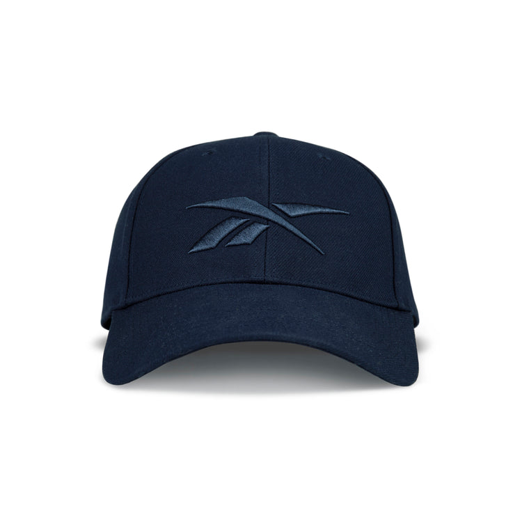 Front view of the Reebok Vector Baseball Cap in dark navy, featuring a curved brim, raised embroidered logo on the front, and adjustable snapback for a custom fit.