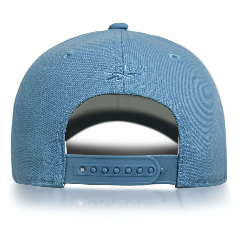 The image displays the back of a blue Reebok Vector Baseball Cap featuring an adjustable snapback closure and the Reebok logo above the opening, blending classic style with sustainable performance.