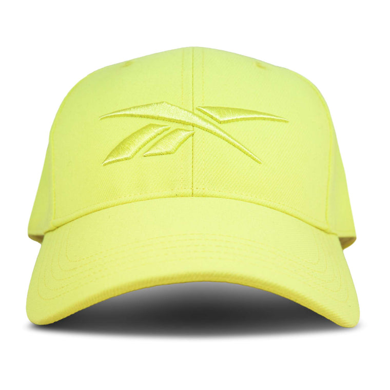 The Reebok Vector Baseball Cap features a yellow, monochromatic design with a curved brim, embroidered front logo, and adjustable snapback closure for comfort.