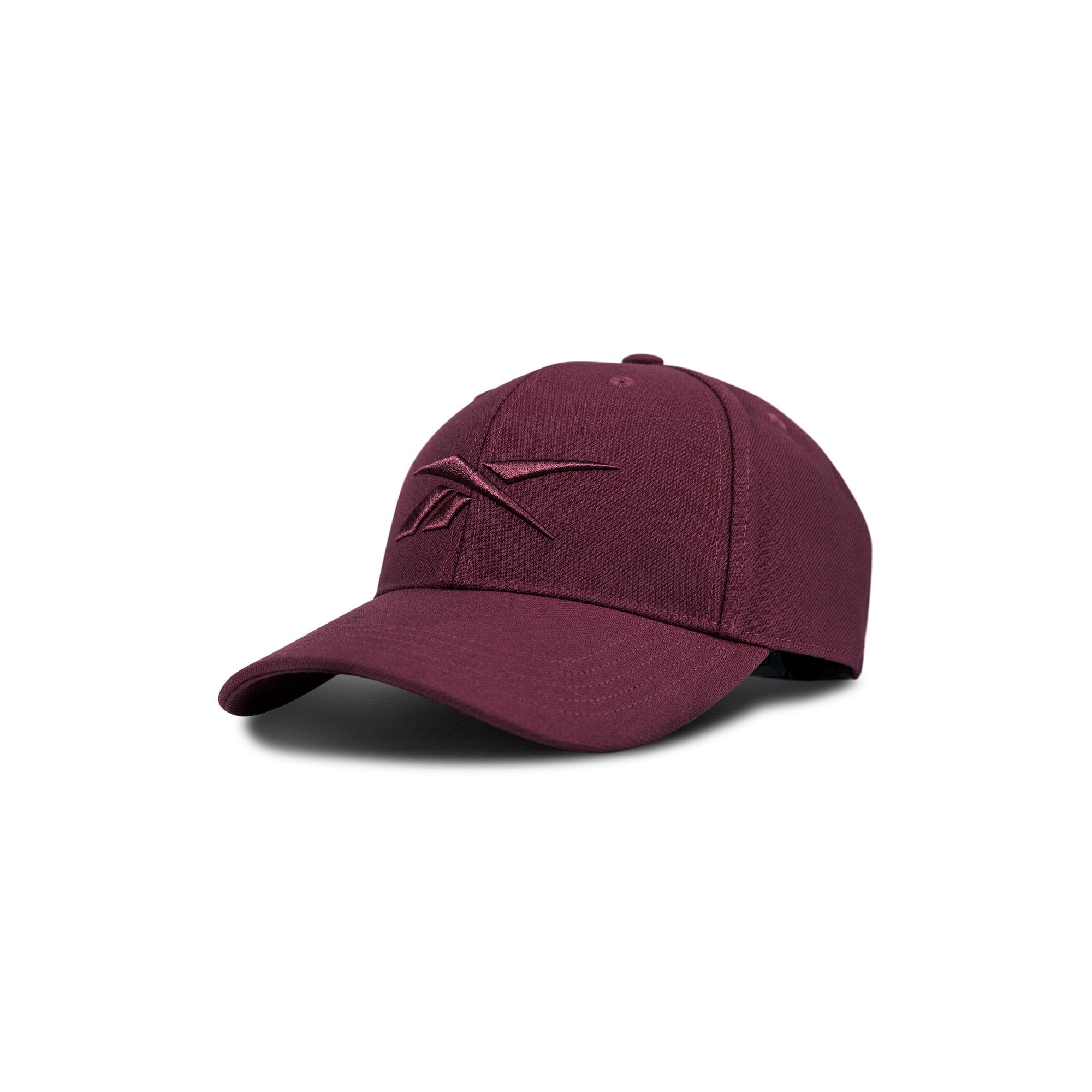 The Reebok Vector Baseball Cap in maroon features a curved brim and an embroidered Reebok logo on the front, displayed against a white background.
