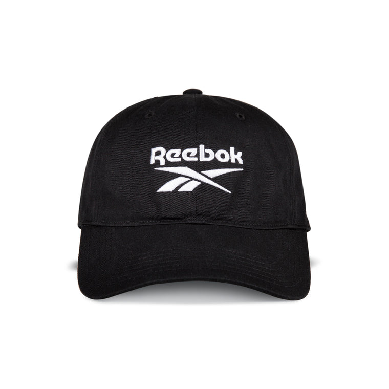 The Reebok Logo Cap is a black cotton twill cap with the Reebok logo and name embroidered in white on the front panel, featuring an adjustable buckle closure for comfort.