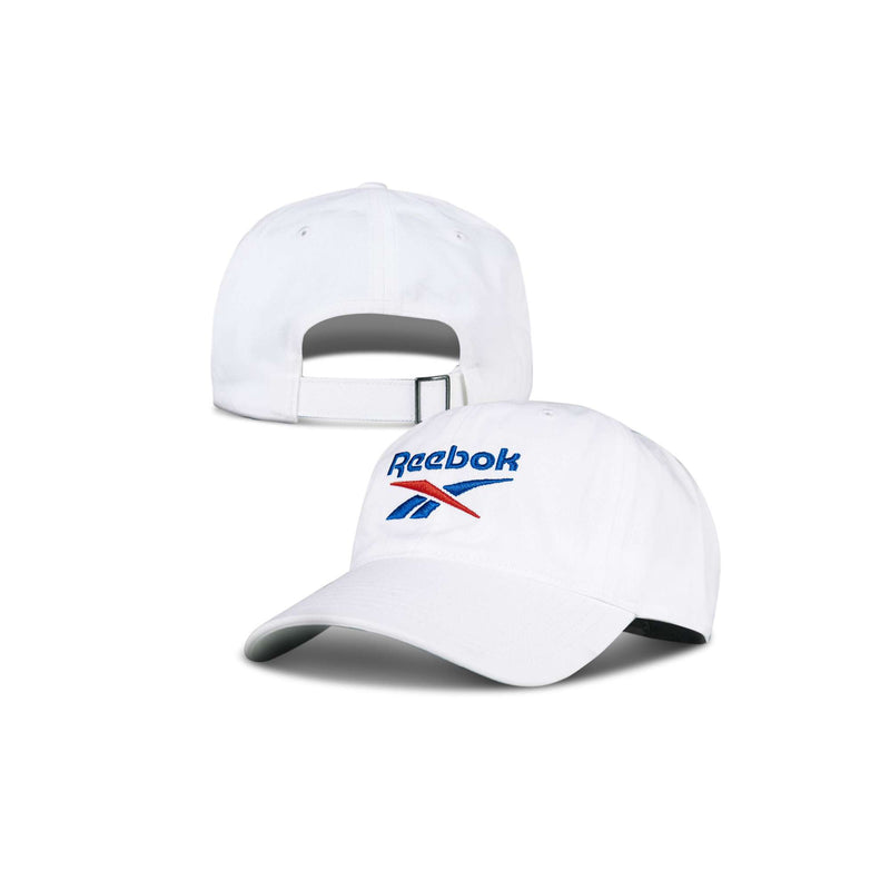 The Reebok Logo Cap is shown from the front and back. It’s white, features the blue and red Reebok logo on the front, and has an adjustable strap at the back.