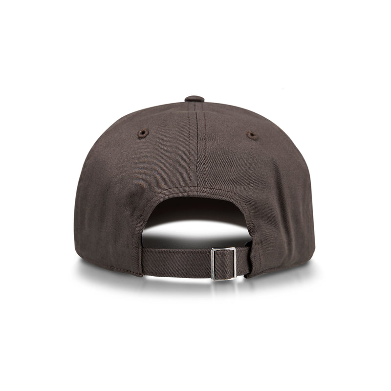 The Reebok Logo Cap is shown from the back against a white background, featuring a brown color, two ventilation eyelets on each side, and an adjustable strap with a metal buckle.