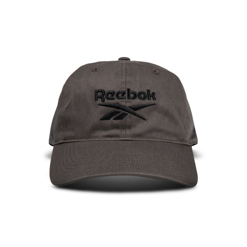 A dark gray Reebok Logo Cap with a black embroidered logo and text on the front is displayed from the front against a white background.