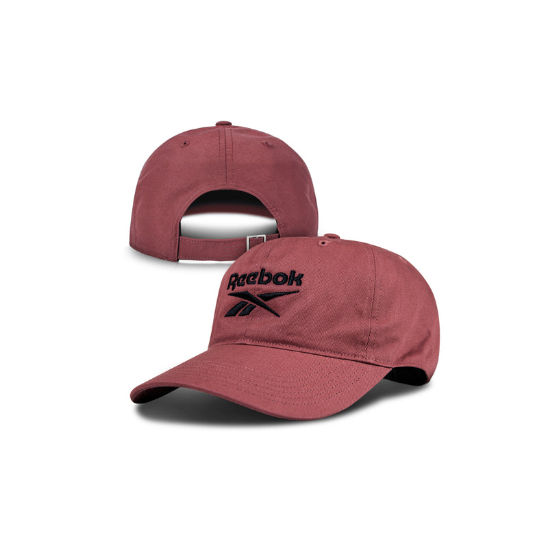 Two views of the Reebok Logo Cap: a maroon cotton twill hat with a curved brim, black Reebok logo on the front, and adjustable buckle closure at the back for comfort and classic style.