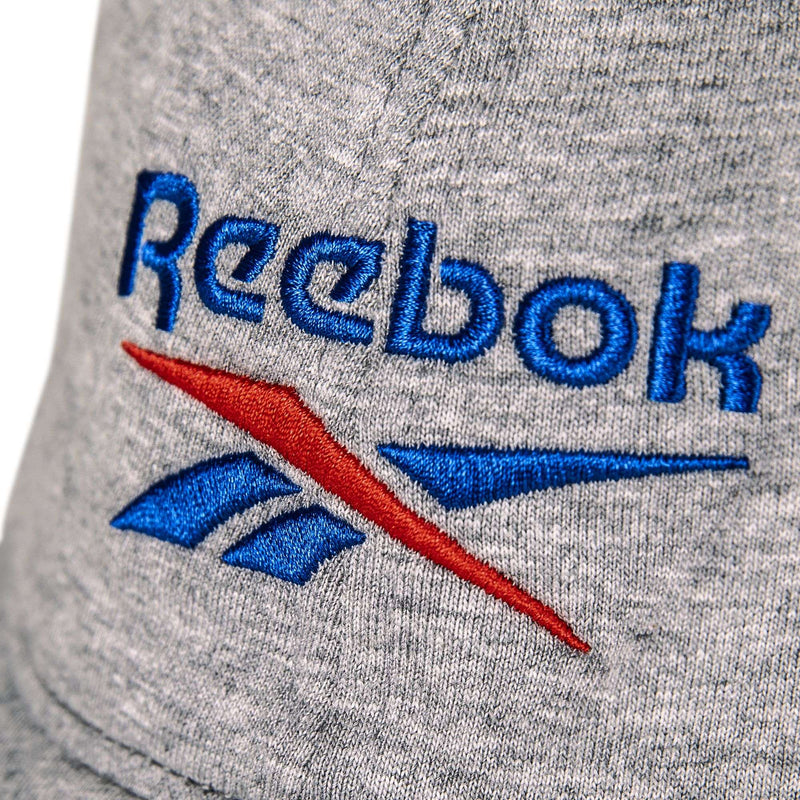 Close-up of the Jersey Logo Cap’s gray fabric, featuring the blue and red Reebok logo embroidered with the brand name and signature vector symbol.