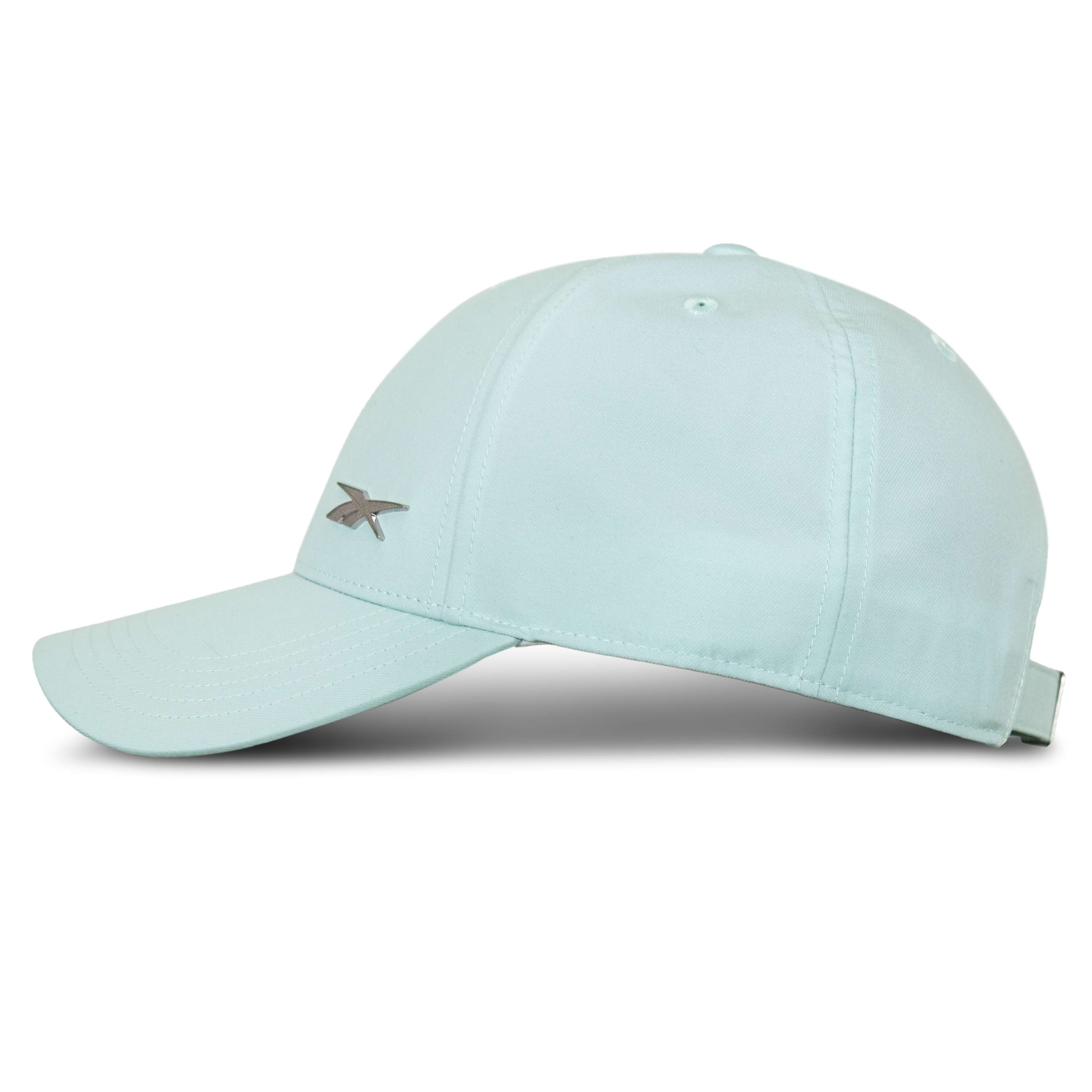 The Reebok Badge Cap in light blue features a curved brim, small silver logo on the front left, and a Speedwick sweatband for moisture-wicking comfort; shown in profile against a white background.