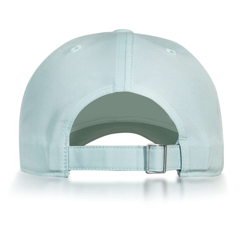 The Reebok Badge Cap in light blue is shown from the back, with an adjustable metal-buckle strap, stitched top-panel eyelets, and a moisture-wicking Speedwick sweatband for comfort.