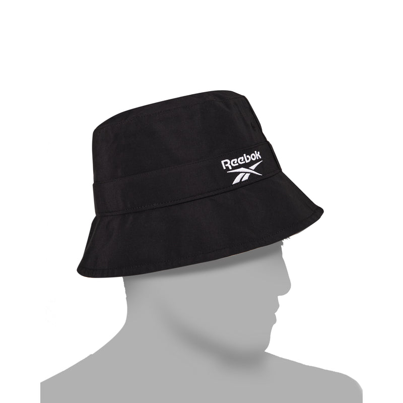 A Reebok Bucket Hat in black with a white logo is displayed on a gray, featureless mannequin head in profile against a plain white background.