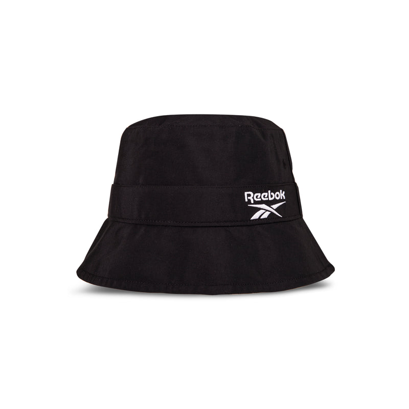 The Reebok Bucket Hat features a wide brim and an embroidered white Reebok logo on the front. Displayed against a plain white background.