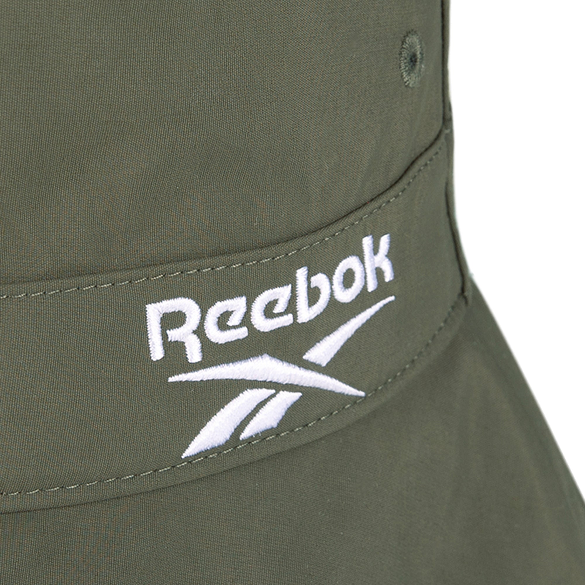 Close-up of a Reebok Bucket Hat in olive green, made from recycled nylon and featuring the white embroidered Reebok logo—a stylish choice for eco-conscious streetwear fans.