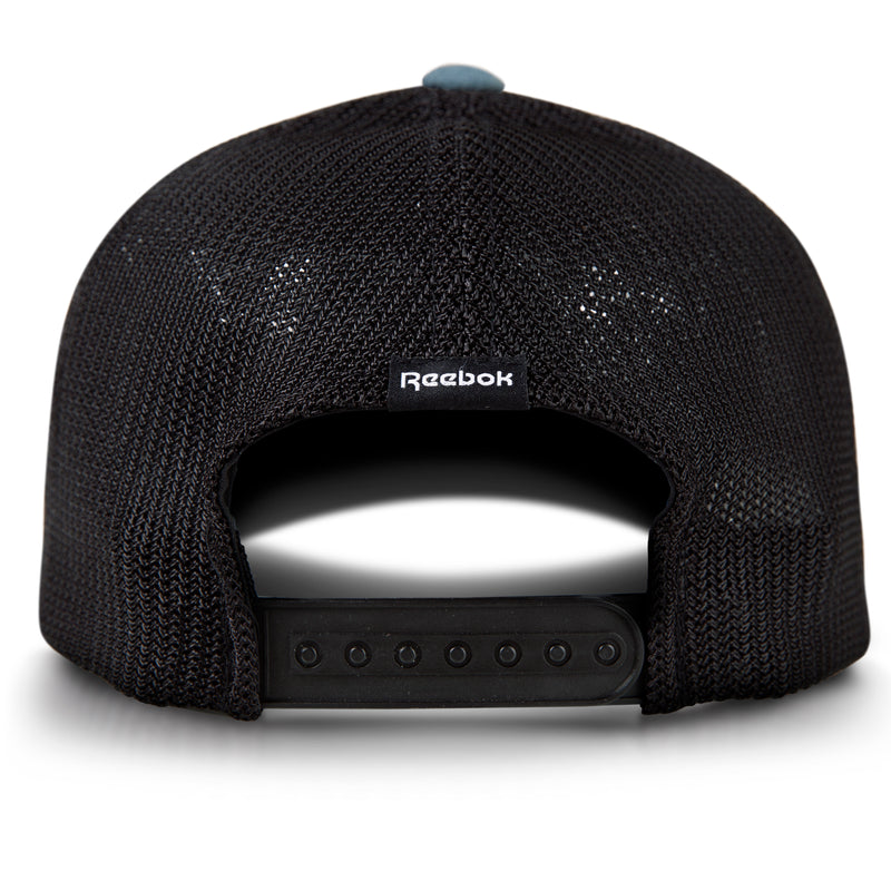Back view of the Reebok Athletic Cap, black mesh with a moisture-wicking sweatband, adjustable strap, and a small Reebok logo tag above the back opening.