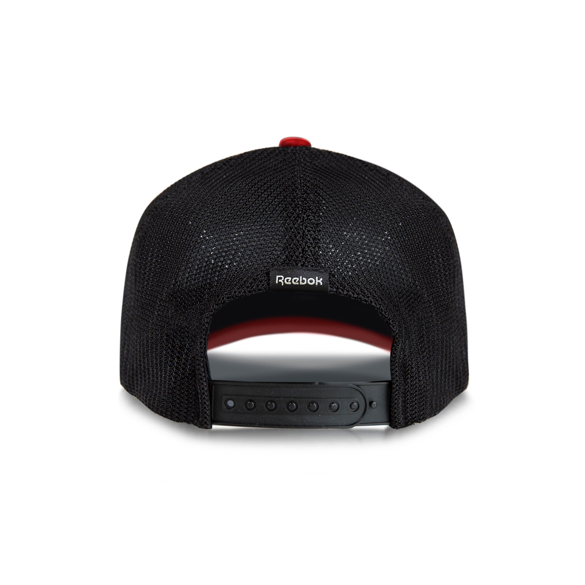 The Reebok Athlete Cap is a black mesh baseball cap seen from the back, featuring an adjustable snapback closure and a small Reebok logo tag above the opening.