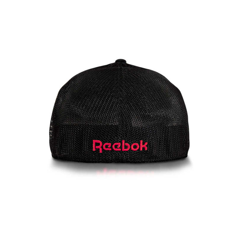 Elite Cap by Reebok shown from the back, features black mesh with the Reebok logo embroidered in pink near the bottom center. Displayed on a white background.