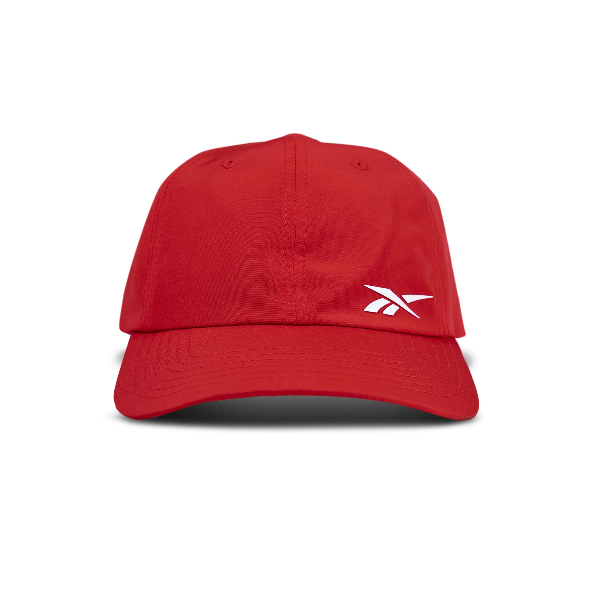 The Reebok Flow Cap is a red baseball cap with a curved brim and a white Reebok logo on the front left panel, shown against a plain white background.