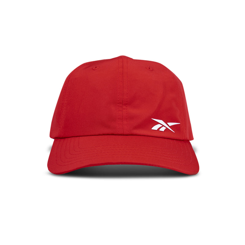 The Reebok Flow Cap is a red baseball cap with a curved brim and a white Reebok logo on the front left panel, shown against a plain white background.