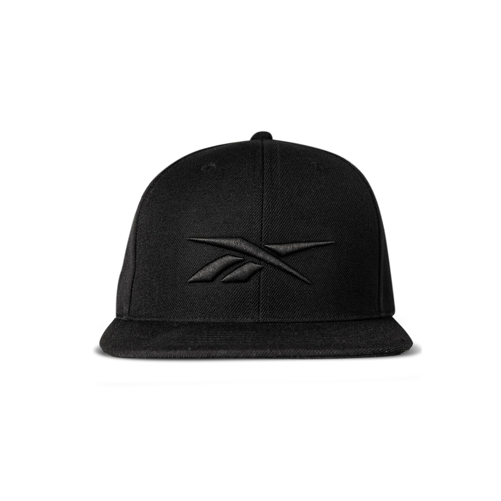 The Reebok Identity Vector Cap is a black snapback hat with a flat brim and adjustable closure, featuring an embroidered black Reebok logo on the front, shown against a white background.